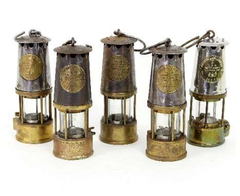 Four miners lamps by The Protector Lamp and Lighting Co., type SL and another type 6