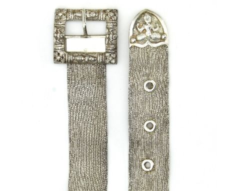 An Indian silver chain link belt, the central section with two square floral panels suspended on a wide link chain, 85cm long