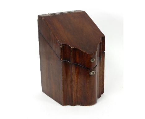 A mahogany knife box with serpentine front, the sloping top with barber pole stringing, the interior gutted and the cover fit