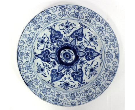 A Chinese export blue and white charger, decorated a central flowerhead to a scrolling foliate border, 39cm diameter   Condit