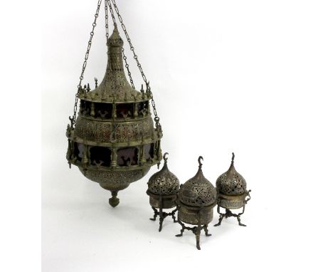 A Moorish temple lantern, pierced and engraved figures, with suspension chains for the same, 57cm high and three temple stand