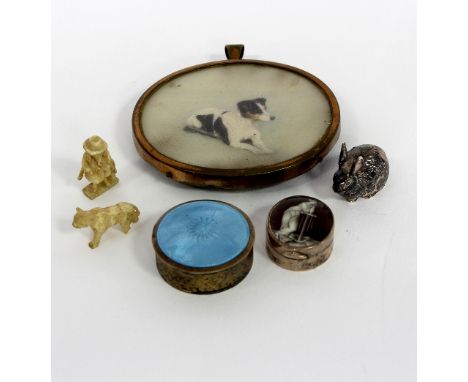 A silver and enamel pill box, WCM, London 1912, the cover decorated Hope and her anchor, 2.5cm wide, a silver rabbit, an oval