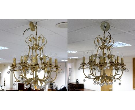 A pair of cream and gold painted ten-light chandeliers, 82cm high