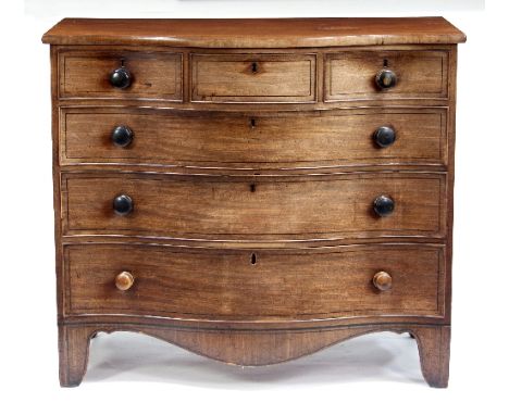 A Regency mahogany serpentine chest, possibly Scottish, of three short and three long drawers, each strung with ebony lines, 