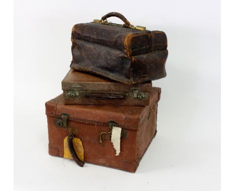 A leather writing case, by John Pound & Co. Ltd., with fitted interior, a leather Gladstone bag and a leather covered trunk
