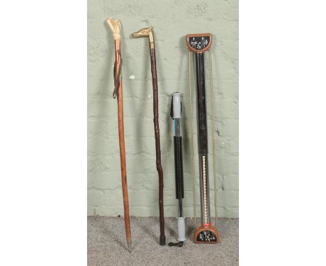 Two walking sticks including bone handled example along with two vintage chest expanders.  