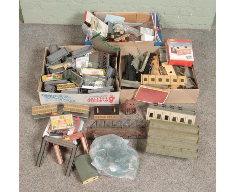 Three boxes of railway diorama accessories including a large quantity of buildings, platform pieces, engine sheds, foliage, s