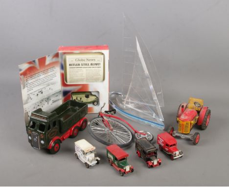 A collection of model vehicles. Includes Wintrade sail boat, Wade Eddie Stobart truck, Zetor tractor, Lledo etc.  