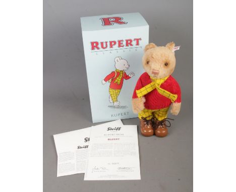 A boxed limited edition Steiff Rupert Bear 653599 with certificate of authenticity. No. 277/1973.  