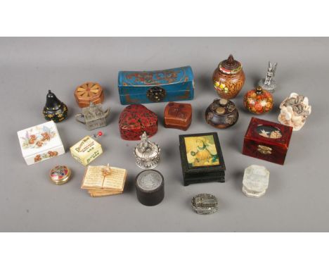 A collection of assorted novelty trinket boxes to include papier mache, hardstone and ceramic examples.  