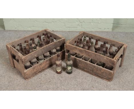 Two vintage wooden Potvin Grard crates with contents of empty bottles. Bottles include Potvin Grard and ABI.  