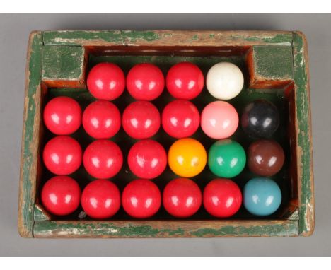 A full set of vintage snooker balls in wooden tray.  
