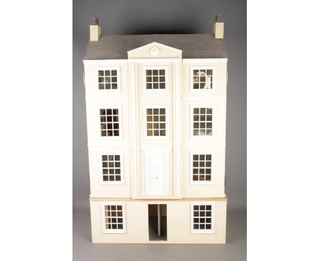 A large three storey fitted doll house complete with electronic wiring and good selection of furniture to include light fitti