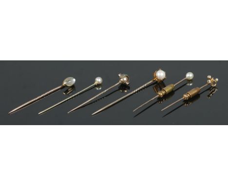 Six gold stick pins, including examples set with diamonds, turquoise stones and pearls. Total weight: 12.3g  