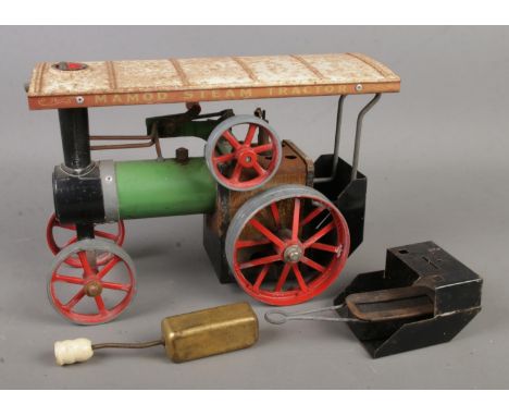 A Mamod steam tractor TE1A.  Some parts may be missing or in poor condition with signs of rusting.