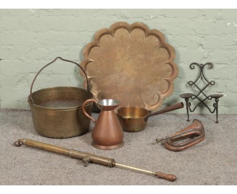 A quantity of metalwares, including jam pan, copper bugle, copper half gallon jug and brass watering rose produced by 'The Fl