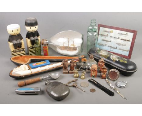 A good quantity of collectables. Includes large cased Meerschaum pipe, papier mache box, ship in a bottle, carved wooden figu