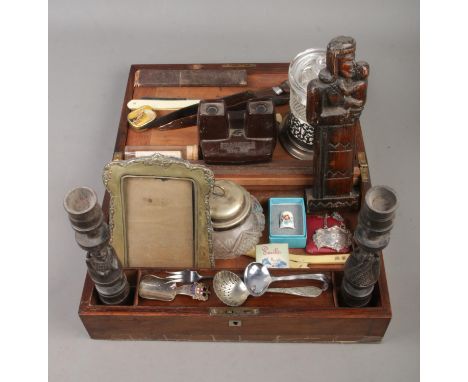 A mahogany writing box containing an assortment of collectables, to include boxed Kindal &amp; Dent razor, His Masters Voice 