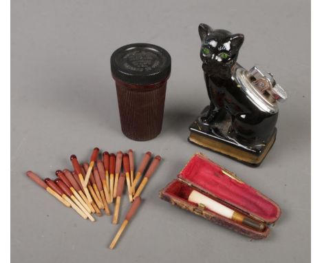 A Bakelite case of Bryant &amp; May Ships Lifeboat Matches along with a novelty ceramic cat lighter and cased cheroot.  