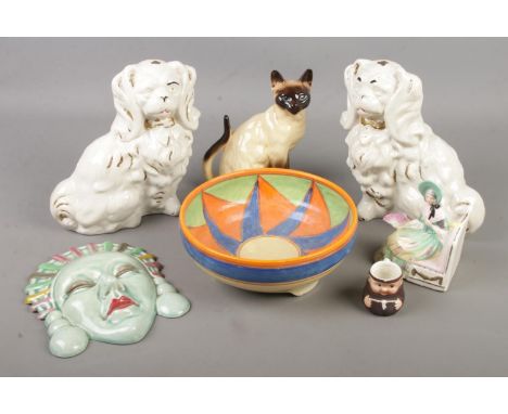 A collection of ceramics. Includes Art Deco style wall plaque and bowl, mantel dogs, Goebel etc.  
