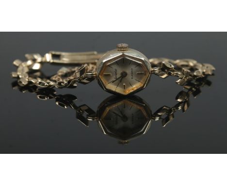 A ladies 9ct Gold Accurist manual wind wristwatch, featuring silvered dial, baton marks and 21 jewel movement. Stamped to the