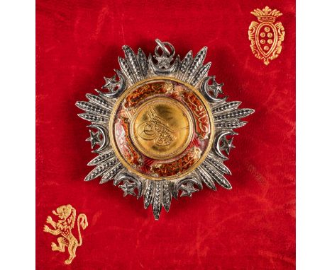 *Ottoman Empire. Order of Medjidie, 4th Class breast badge, 55m.,  silver, gold and enamel, with rear brooch fixing, some dam