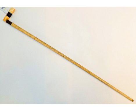 *Cane.  A 19th-century marine ivory walking stick,  with horn segments to the handle, 80.5cm long    (1)