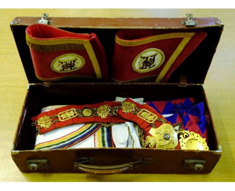*Masonic Regalia. A collection of regalia,  including a brown leather case containing gilt metal and enamel collar, cuffs and