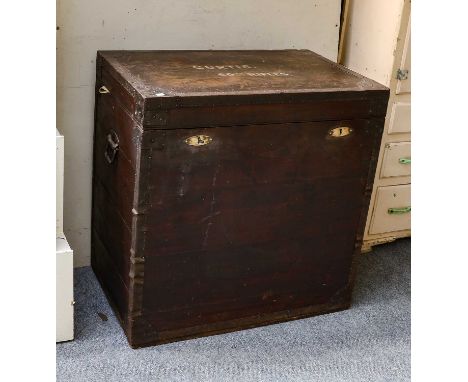 A large 19th century metal bound military trunk with brass escutcheons, the top stencilled Curtis 60th Rifles, label inside f