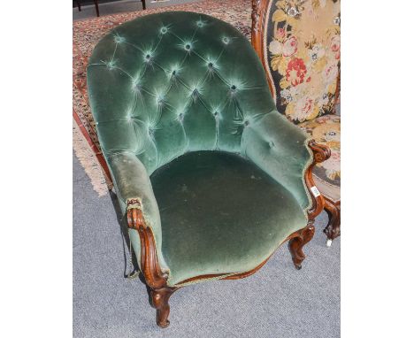 A Victorian button back tub chair on scroll carved mahogany frame