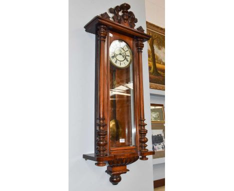 A Vienna type double weight driven wall clock, circa 1890The case is slightly faded in parts, small scratches, the door with 