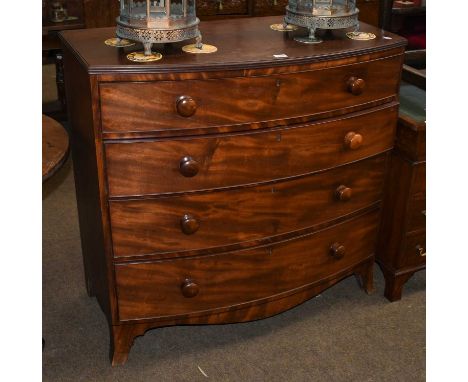 A George III mahogany four-height bow fronted chest of drawers raised on splayed bracket supports, with reeded mouldings and 