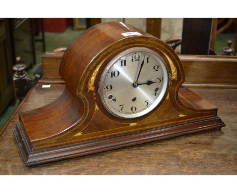 An Edwardian mahogany inlaid mantel clock, outlined with ebony and boxwood stringing, silvered dial, Arabic numerals, three w