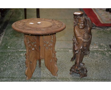 A Japanese rootwood carving as an elder, a folding eastern tripod table (2)