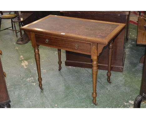 A Victorian lady's writing desk, rectangular leather inlaid top, single drawer to frieze, turned tapering supports, ceramic c