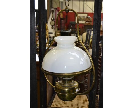 A lacquered brass hanging lantern, opaque white glass shade; two pairs of brass wall lights; a cast metal ceiling light (6)