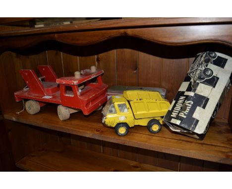 Vintage toys - Middon Paris roller skates (boxed); tin plate Tonker Tipper Truck; a Stabol wooden flatbed truck; a railway ca