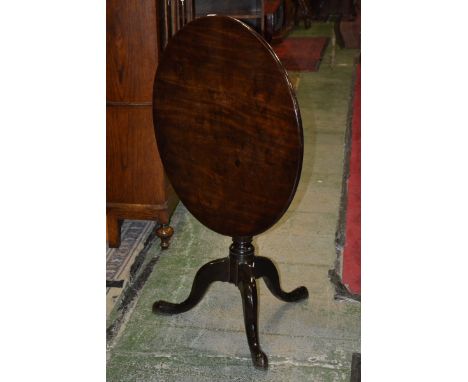 A George III mahogany tilt-top table, circular top, turned support with tripod base, 78cm diameter, 72cm tall, c.1810.