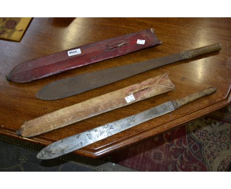 A Maasai short sword or dagger, hide grip and scabbard, Kenya, early 20th century century; another, similar (2)