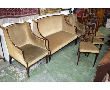 An Edwardian mahogany seven piece salon suite, comprising sofa, pair of armchairs and four matching dining chairs, all with b