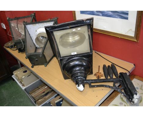A copper and iron street lantern top, from Hoddestone, Hertfordshire, another street lantern, c.1940, and another (3)