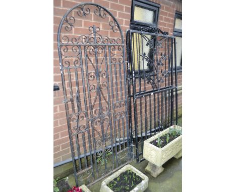 A wrought iron archtop garden gate, c.1900 and a pair of wrought iron gates (3)