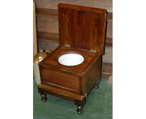 A single step commode stool.