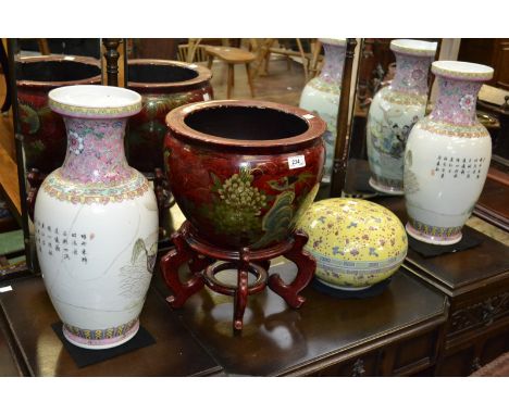 A pair of Chinese export ware famille rose baluster vases; a similar modern jardiniere on stand; a large circular jar and cov