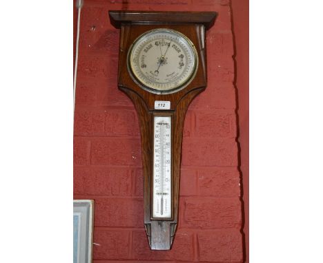 An Art Deco oak barometer