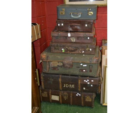 Vintage luggage - a leather travel trunk by A Barrett & Sons, 157 & 158 Piccadilly, London; two wood bound travel trunks; two