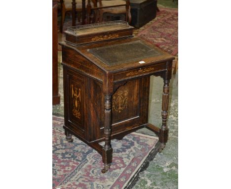 A late Victorian rosewood Davenport, leather inset top, inlaid panels, turned fluted supports, ceramic casters c.1895