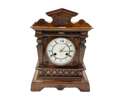 Vintage carved walnut mantel clock with enamel dial, 41cm.