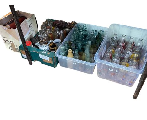 Collection of vintage glass bottles, advert milk bottles, wood bowls, mantel clock, wooden bobbin, etc.