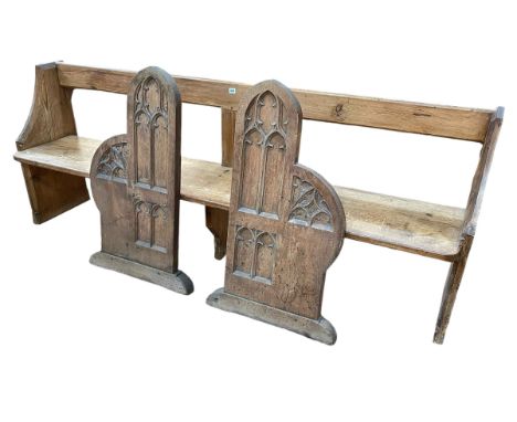 Victorian pitch pine church pew, 81cm by 212cm by 43cm, and pair Gothic style oak church pew ends.